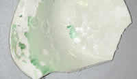 Glaze buckling and lifting as a result of salts