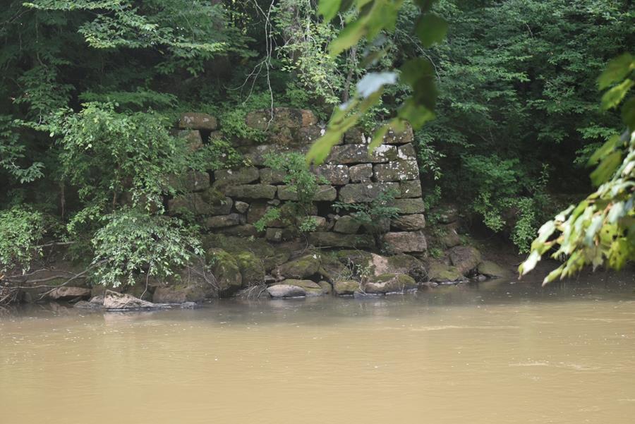 Site 44PY0539, bridge abutment, looking south along the right bank. Photo by Dwayne Pickett, Hurt & Proffitt.