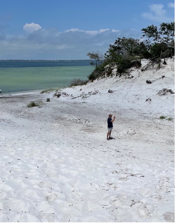  Image 4. Mike Thomin photographs a site on Santa Rosa Island during a photogrammetric survey. Equipment for photogrammetry generally requires only a photographer, a camera, and photos scales or printed targets. 